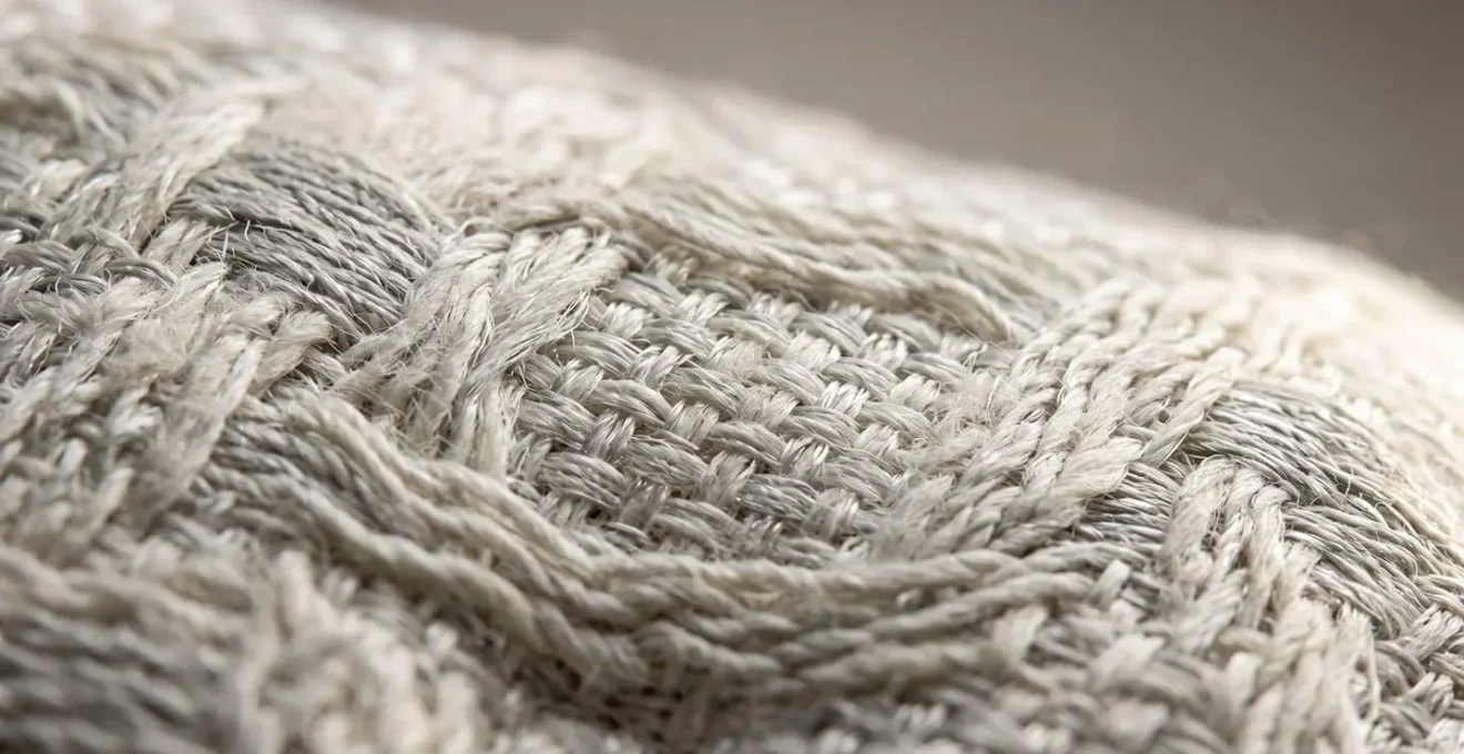 Close-up demonstration of motion isolation in mattress materials showing energy absorption