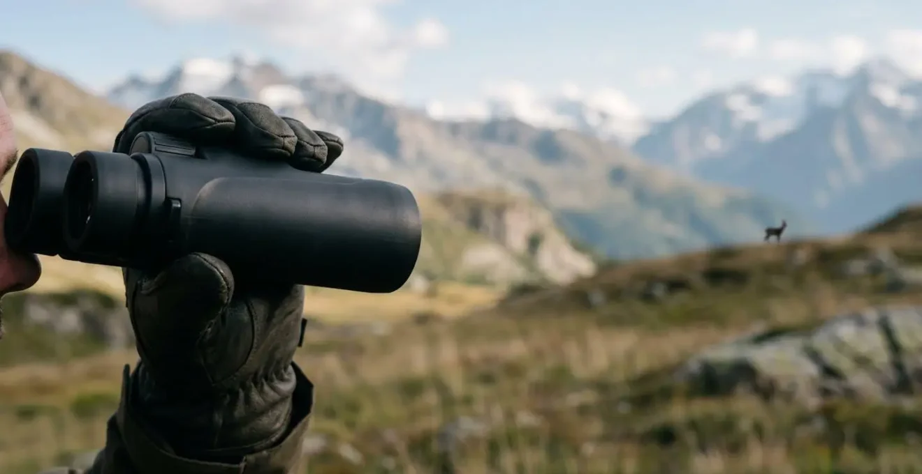 Symbolic representation of responsible wildlife observation through binoculars maintaining safe distance in natural habitat